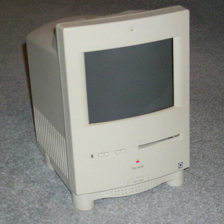 sample music video on the old black apple laptop 1990s